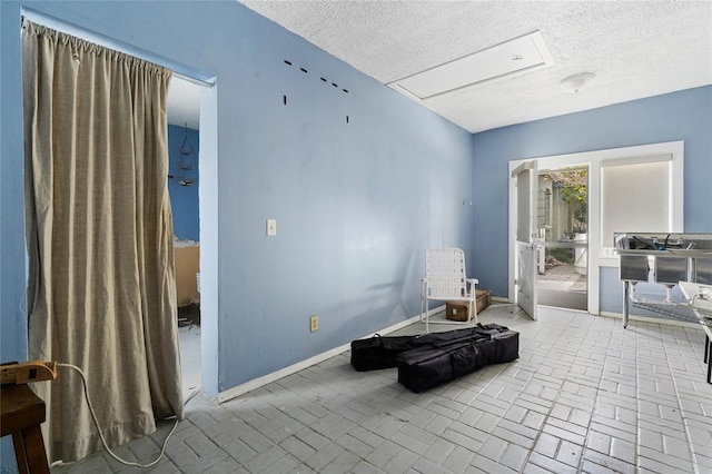 sitting room with a textured ceiling