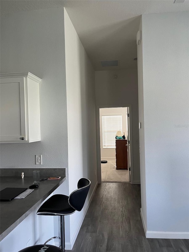 hall featuring dark wood-type flooring