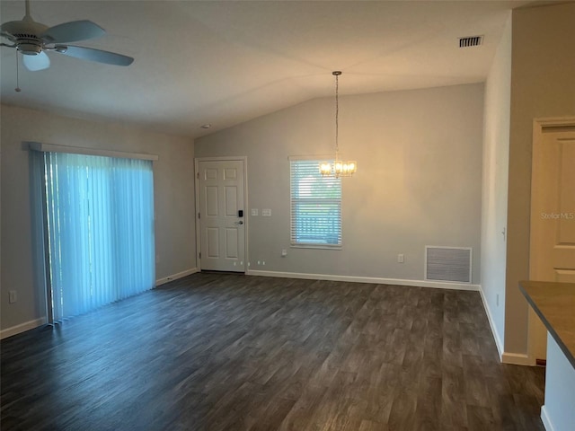 interior space with vaulted ceiling, dark wood-type flooring, and ceiling fan with notable chandelier