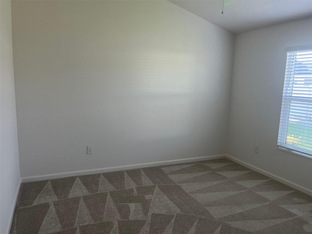 spare room with carpet and plenty of natural light