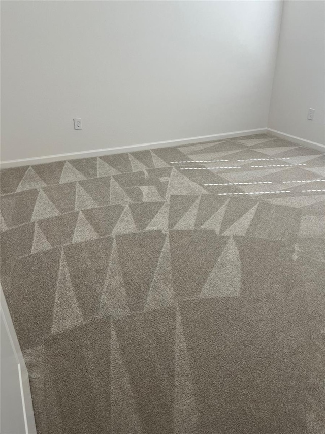 unfurnished room with carpet floors