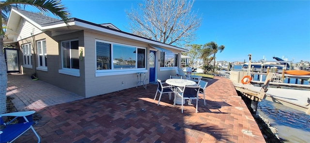 view of patio featuring a boat dock