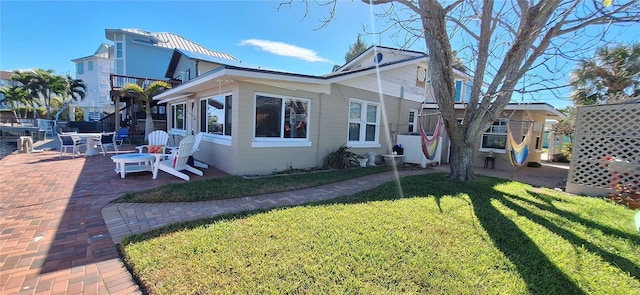 view of home's exterior featuring a yard and a patio