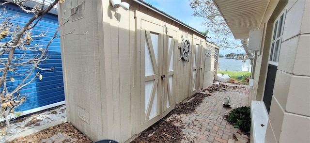 view of property exterior with a water view