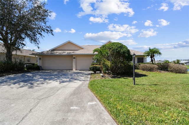 single story home with a front yard and a garage