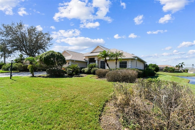 ranch-style house with a front lawn