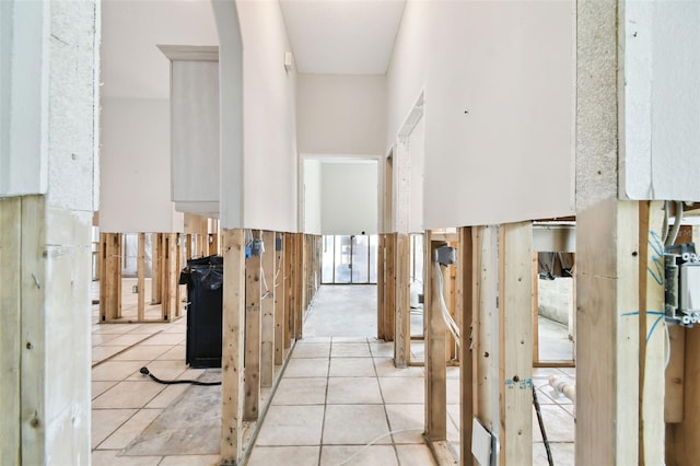 hall with light tile patterned flooring