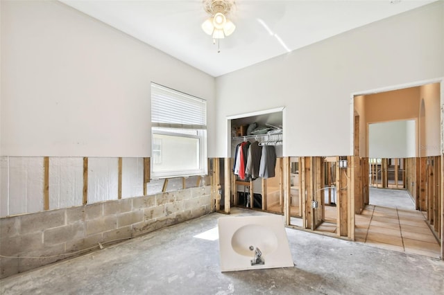 bathroom featuring ceiling fan and concrete floors