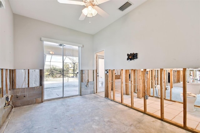 empty room with concrete flooring and ceiling fan