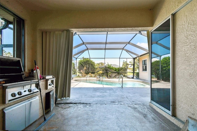 view of patio / terrace featuring a lanai