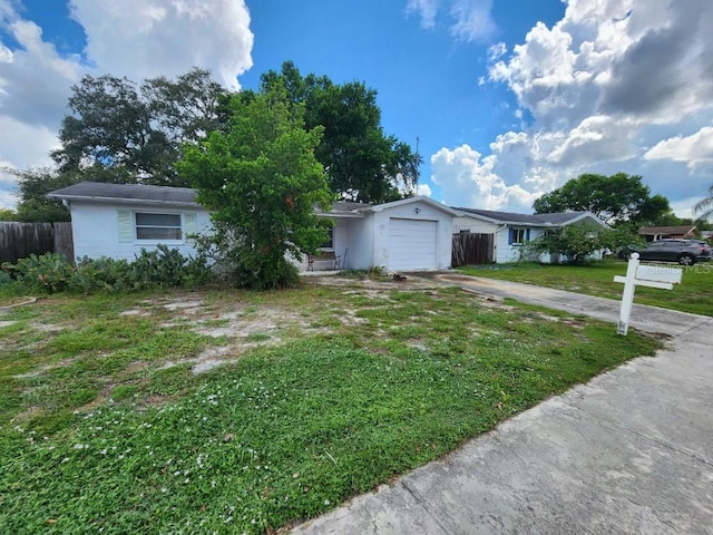 view of front facade with a garage and a front yard