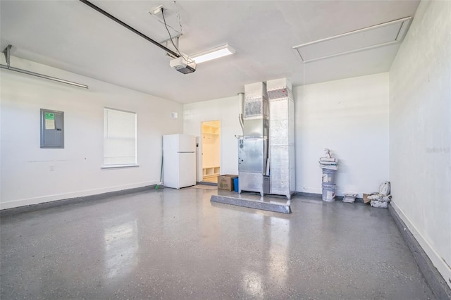 garage featuring a garage door opener, electric panel, white refrigerator, and heating unit