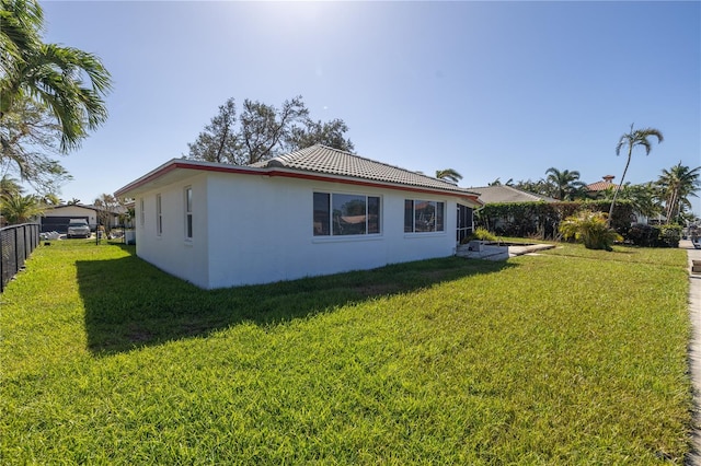 view of property exterior featuring a yard