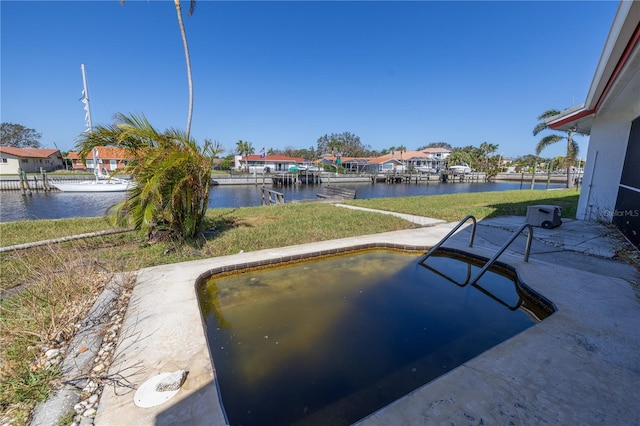 view of swimming pool featuring a water view