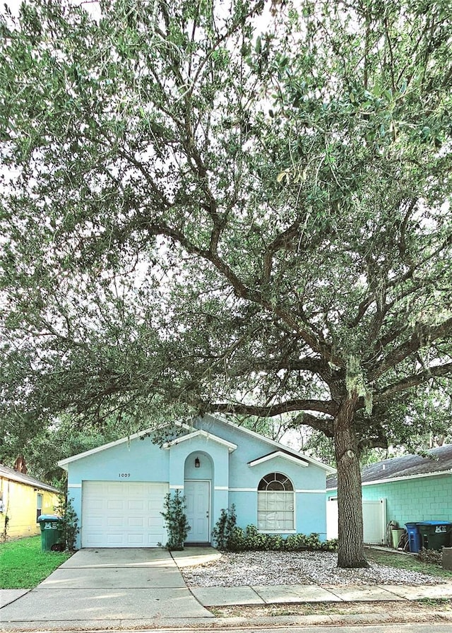 ranch-style house featuring a garage