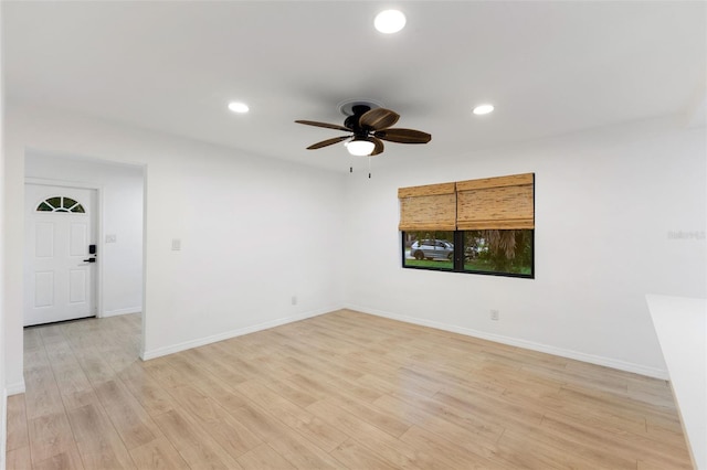 unfurnished room featuring ceiling fan and light hardwood / wood-style floors