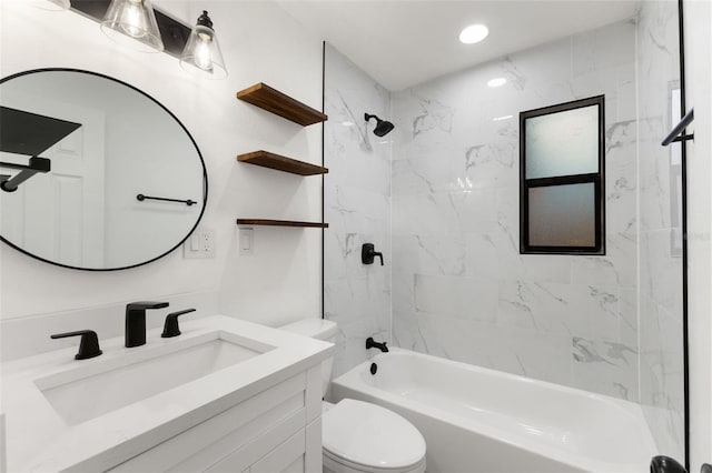 full bathroom with toilet, tiled shower / bath combo, and vanity