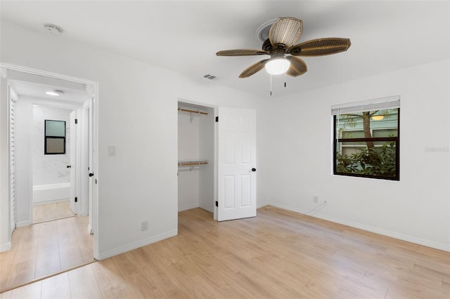 unfurnished bedroom with ceiling fan, a closet, and light hardwood / wood-style flooring