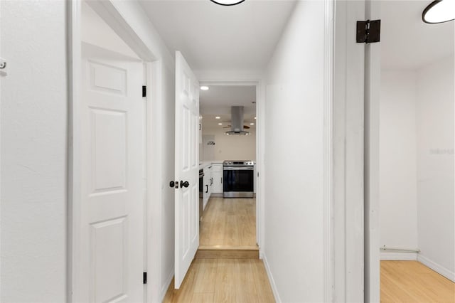 hallway featuring light hardwood / wood-style flooring