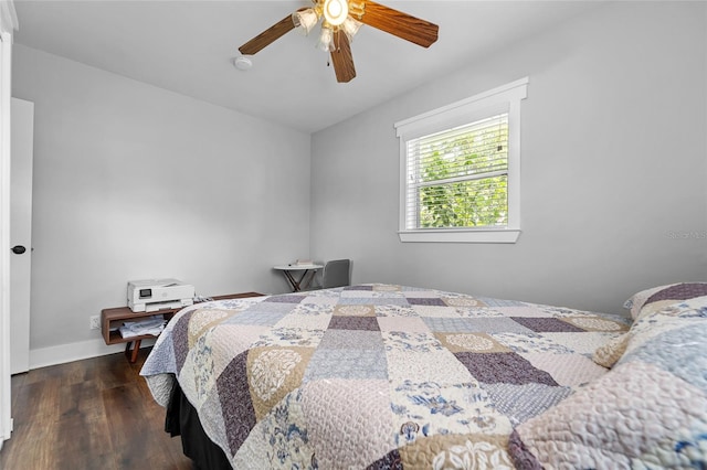 bedroom featuring ceiling fan and dark hardwood / wood-style floors