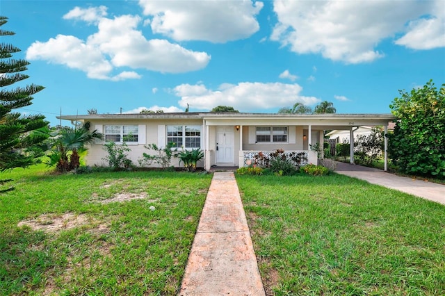 single story home featuring a carport and a front yard