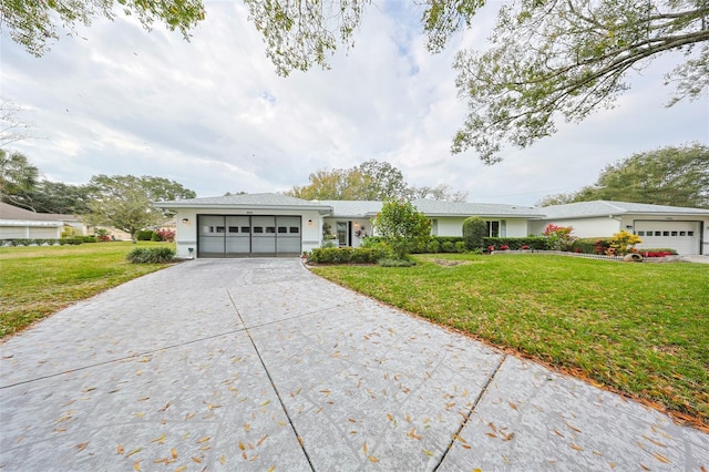 single story home featuring a front yard and a garage