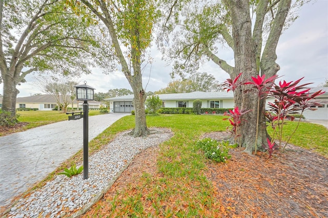 exterior space with a front yard and a garage