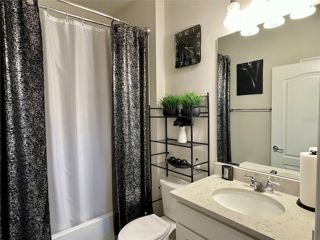 full bathroom featuring shower / bath combination with curtain, vanity, and toilet