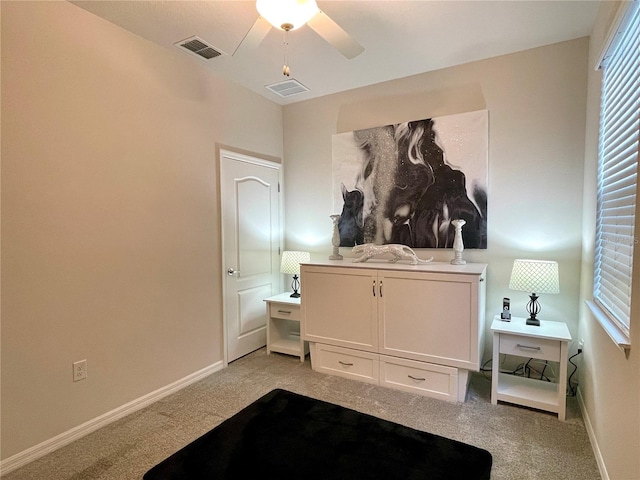 bedroom featuring ceiling fan and light carpet