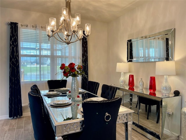 dining area featuring a chandelier and light wood-type flooring