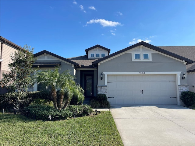 view of front of house featuring a garage and a front yard