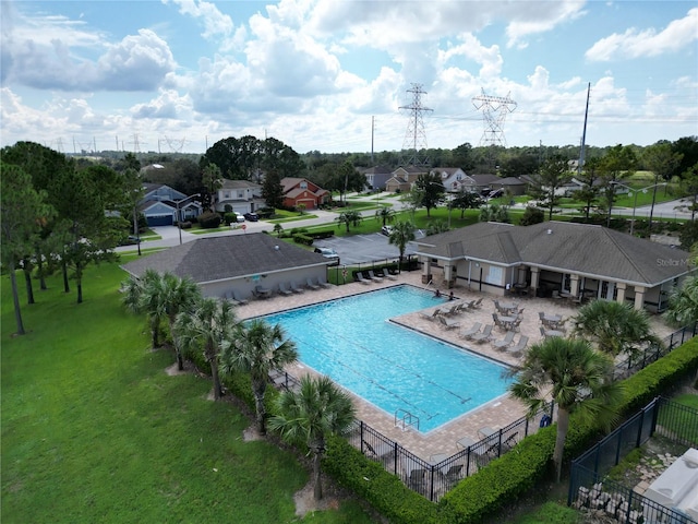 view of swimming pool featuring a patio area and a lawn