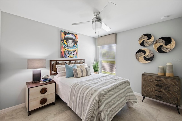 bedroom featuring ceiling fan and light tile patterned floors