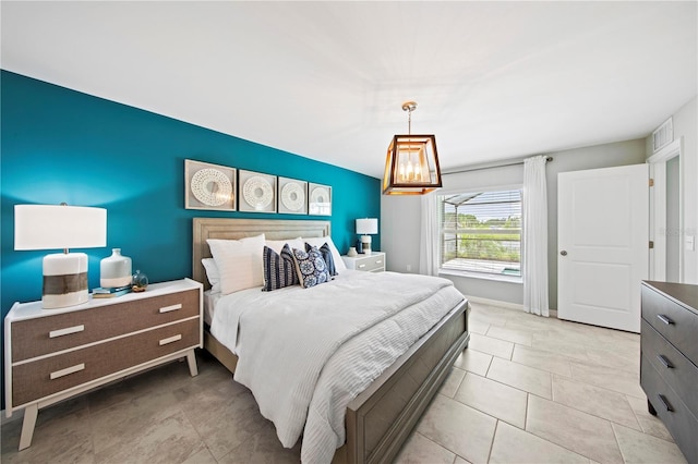 bedroom featuring light tile patterned floors