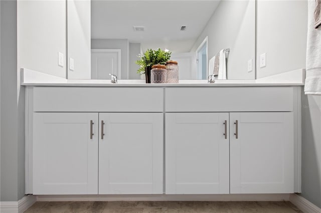 bathroom featuring tile patterned floors and vanity