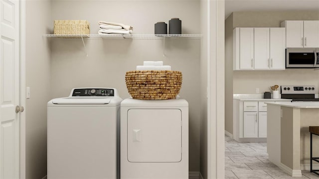 washroom featuring washer and dryer