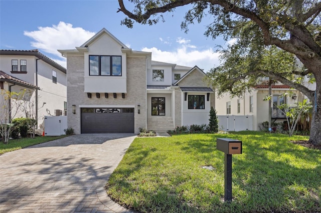 view of front of house with a front lawn and a garage