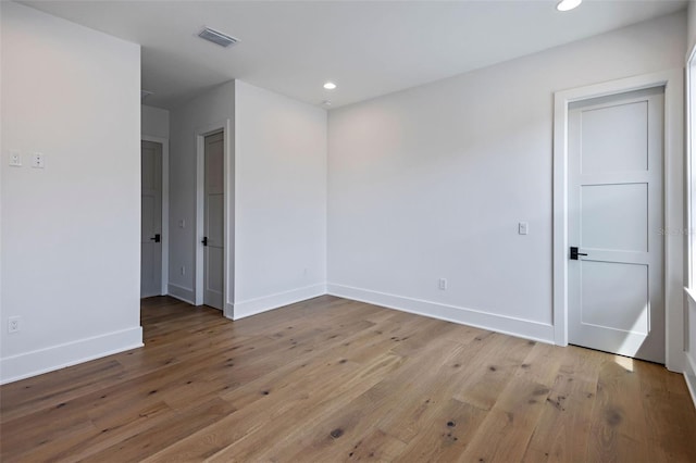 unfurnished room featuring light hardwood / wood-style flooring