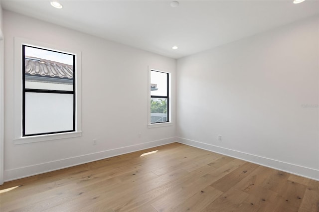 unfurnished room featuring light hardwood / wood-style flooring