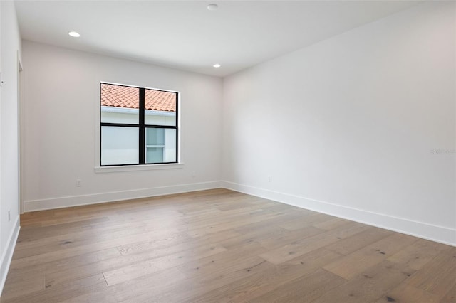 unfurnished room featuring light hardwood / wood-style flooring