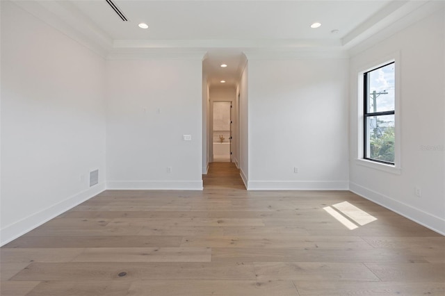 spare room featuring light hardwood / wood-style floors