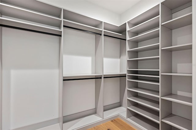 spacious closet featuring hardwood / wood-style floors