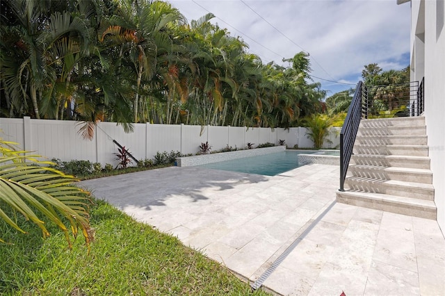 view of pool featuring a patio