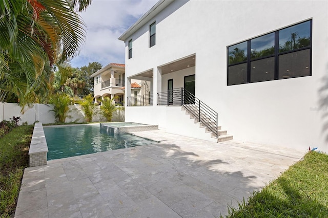 view of swimming pool featuring a patio area