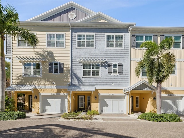 multi unit property featuring a garage