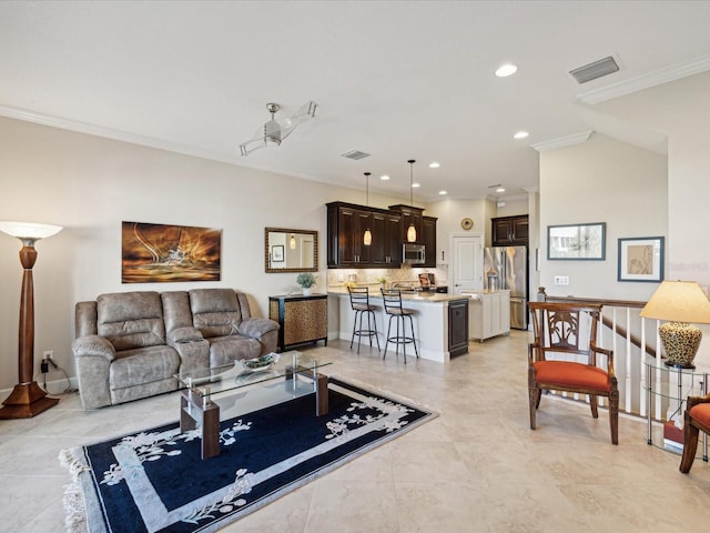 living room with crown molding and light tile patterned floors