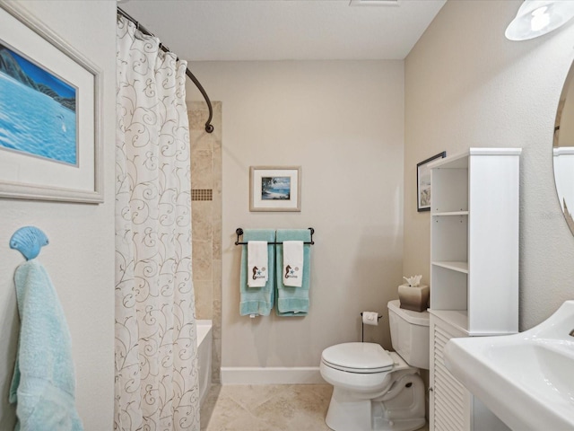 full bathroom with tile patterned floors, sink, shower / tub combo with curtain, and toilet