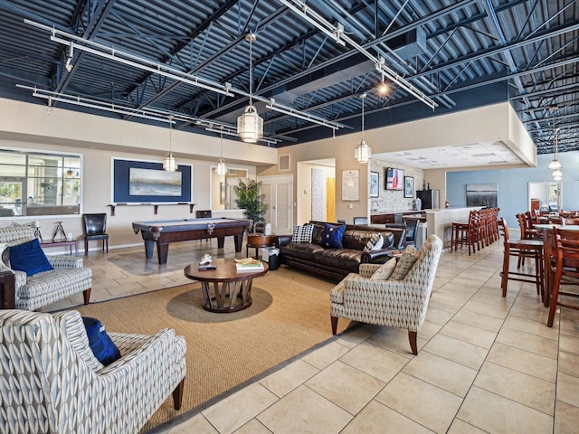 living room with tile patterned floors and billiards