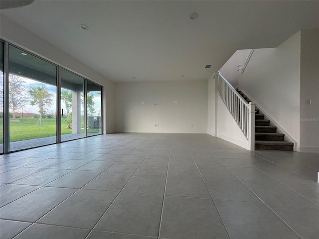 spare room featuring light tile patterned floors