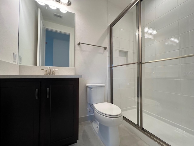 bathroom with vanity, toilet, and walk in shower